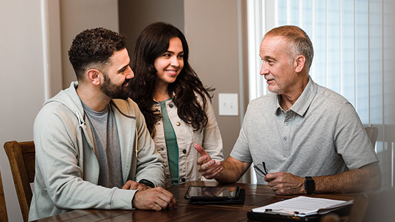 Couple discussing finances with an advisor
